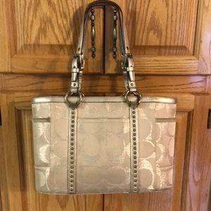 Gold coach bag